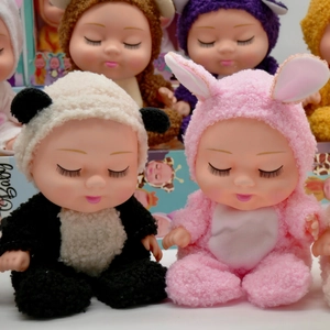Close-up of assorted 8-inch sleeping baby dolls in plush panda and bunny onesies