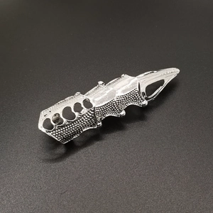 Silver gothic punk full finger armor ring with heart cutouts on black background