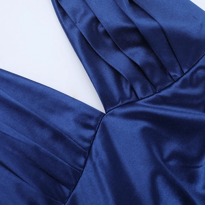 Detail of the deep V-neckline and draped pleats on this elegant navy blue satin dress