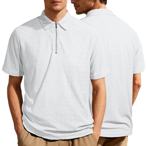 Macro detail of white polo shirt showing geometric waffle knit texture and zipper neckline