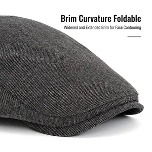 Dark grey knitted ivy cap for men featuring a curved wide brim and textured blend fabric