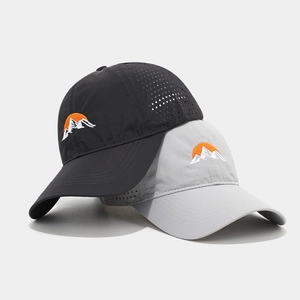 Detail of breathable laser-cut holes and mountain embroidery on quick-dry baseball caps