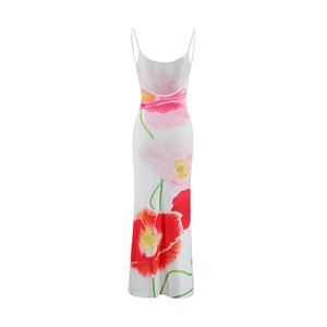 Detail of the low back cut and vibrant floral print on a white summer maxi dress