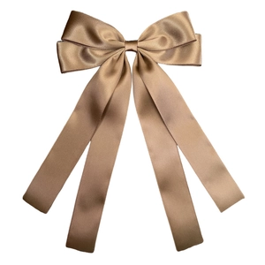Champagne gold satin double bow hair clip with long ribbons on white background