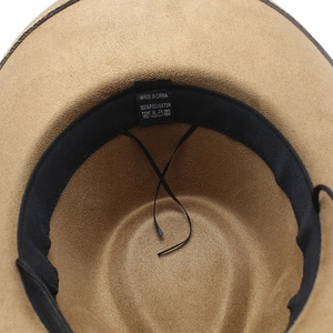 Detail view of khaki faux suede cowboy hat interior with sweatband and adjustable drawstring