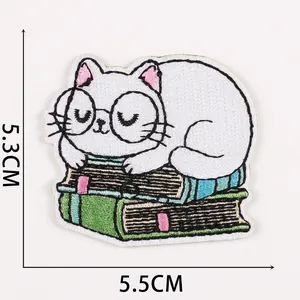 Detail of cartoon cat embroidery patch on books with dimensions 5.5cm x 5.3cm