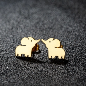 Polished gold-plated elephant stud earrings in stainless steel on black texture background