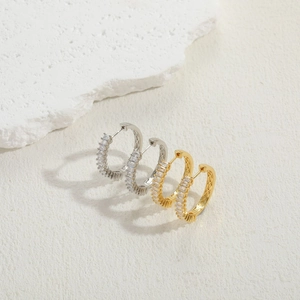 Detailed view of luxury square zircon earrings in gold and silver finish with 14K plating