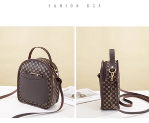 Detail view of small round crossbody bag in dark brown with geometric dot patterns