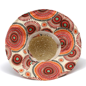 Close-up of bohemian pattern on wide brim straw hat with breathable woven texture
