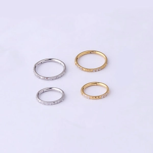 Polished stainless steel nose rings set with cubic zirconia in gold and silver finishes