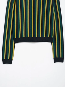 Detail of multi-color vertical stripes and dark blue ribbed cuffs on knit top
