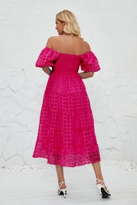 Detail view of the back of a fuchsia puff sleeve dress with textured plaid jacquard fabric