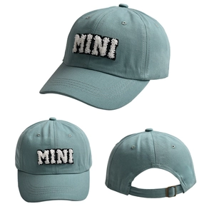 Detailed view of grey blue baseball cap with white MINI towel embroidery and adjustable metal buckle