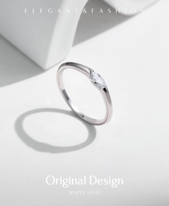 Macro shot of minimalist S925 silver ring featuring a sparkling marquise cut zircon