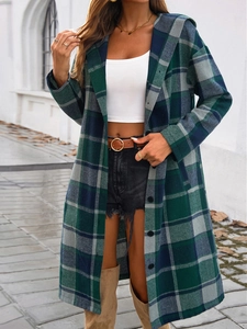 Street style view of women's loose green plaid hooded coat with single-breasted buttons
