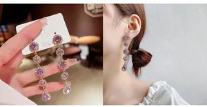 Detail of long tassel earrings with purple gemstones and 925 silver needle drop design