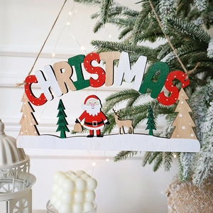 Wooden Merry Christmas ornament with Santa and reindeer hanging on a lit Christmas tree