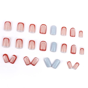 French tip press-on nails set with red and blue square oval designs on white background