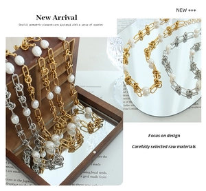 Detail of double-layer gold and silver necklaces with pearls and twisted metal chains