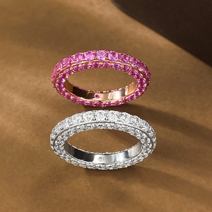 Luxurious rose gold and silver eternity rings with full pave-set sparkling crystals