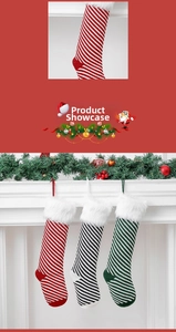 Close-up of red, black and green striped Christmas stockings with plush white faux fur cuffs