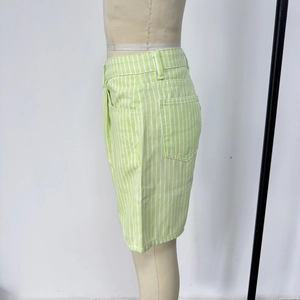 Detail showing vertical light green stripes on high waist denim shorts with side pockets