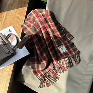 Classic plaid scarf in red and brown with fringe and polyester material label
