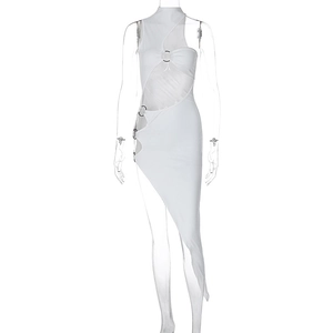 Detailed view of white cut-out dress featuring metal rings and asymmetric hemline
