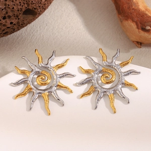 Dual-tone sun spiral earrings in 18K gold plated stainless steel on a ceramic tray