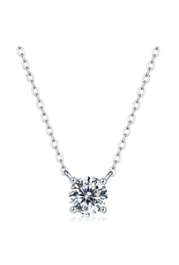 Detailed macro view of 7mm round cubic zirconia pendant on a stainless steel chain