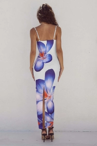 Detail view of the open-back design and blue floral print on this slim maxi dress