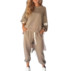 Khaki two-piece knit set featuring long sleeve sweatshirt and wide leg pocket pants