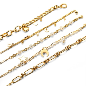 Set of 18K gold plated stainless steel bracelets with star, moon, and pearl charms