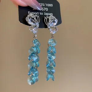 Boucles d'oreilles papillon à pompons en argent S925 avec cristaux bleu clair et strass
