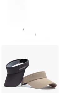 Detailed view of sun visor hats in purple, black, and khaki with wide brim design