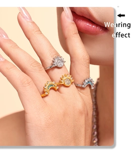 Close-up of zircon sun and moon rings in gold and silver finish showing wearing effect