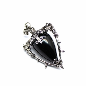 Close-up of teardrop labradorite stone set in silver filigree star and vine pendant