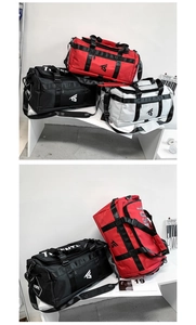 Detail view of large capacity Oxford cloth travel bags in red, black, and white colors