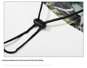 Detail of adjustable windproof chin strap and toggle on camouflage boonie hat