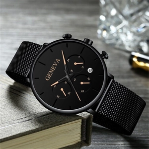 Business style black stainless steel mesh watch with golden hands on wooden background