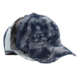 Streetwear distressed denim baseball cap with patchwork design and frayed edges on white background