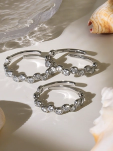 Macro detail of adjustable silver ring with sparkling round cubic zirconia bubble setting