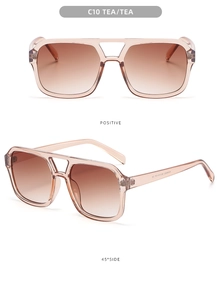 Detail of pilot sunglasses with tea gradient lenses and transparent brown frames