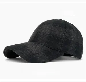 Detailed texture of thick dark gray wool blend fabric on a structured baseball cap