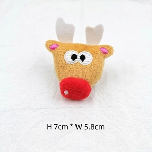 Macro detail of cartoon reindeer plush accessory with 7cm height and soft yellow fabric