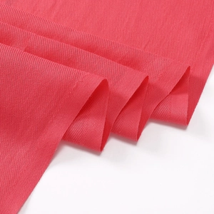 Close-up of red cashmere-like scarf showing fine woven texture and soft fabric details