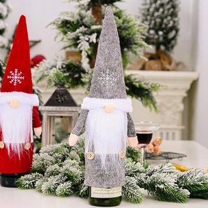 Christmas gnome wine bottle covers in red and grey felt with snowflake embroidery