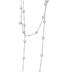 Elegant multi-layer glass pearl necklace with soft luster on a minimalist gold chain
