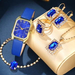 Detail view of gold and blue quartz watch set with necklace, earrings and bracelet